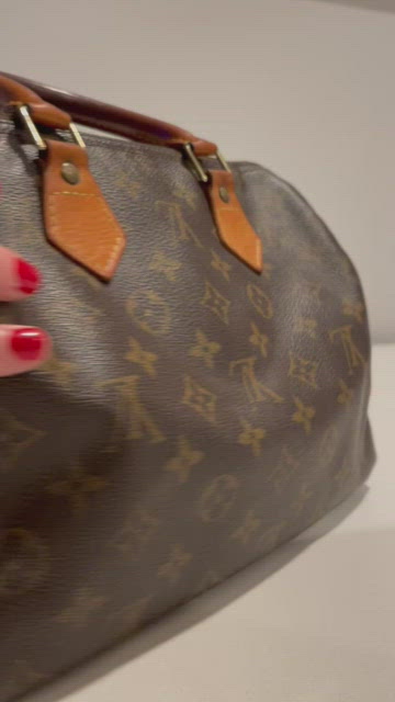 Sold at Auction: A LOUIS VUITTON EPI LEATHER SPEEDY 25; in Cipango